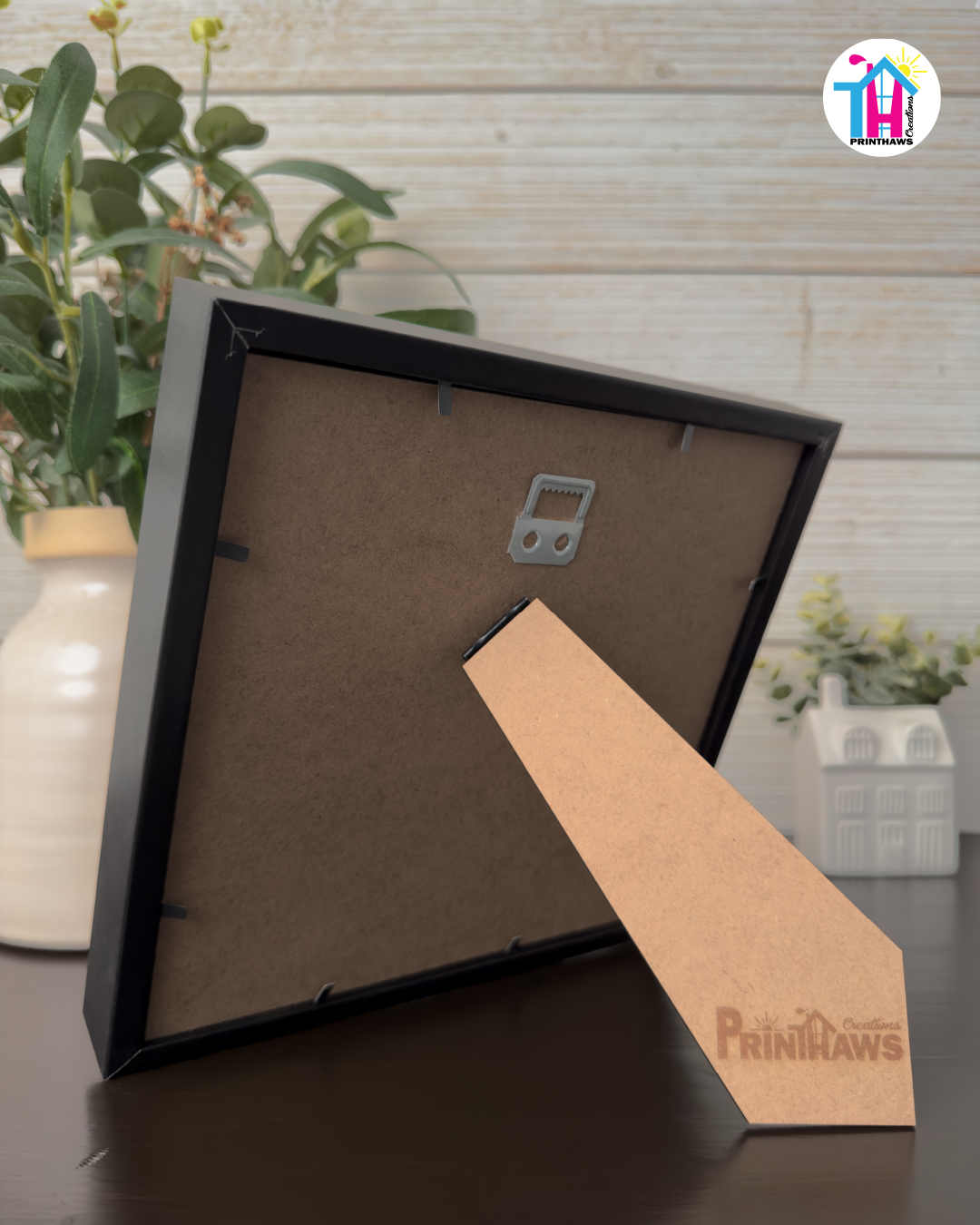 Crafted Memoirs Photo Frame By Printhaws Creations, Back View Of Matte Black Frame Showing MDF Backing With Foldable Easel And Sawtooth Hanger