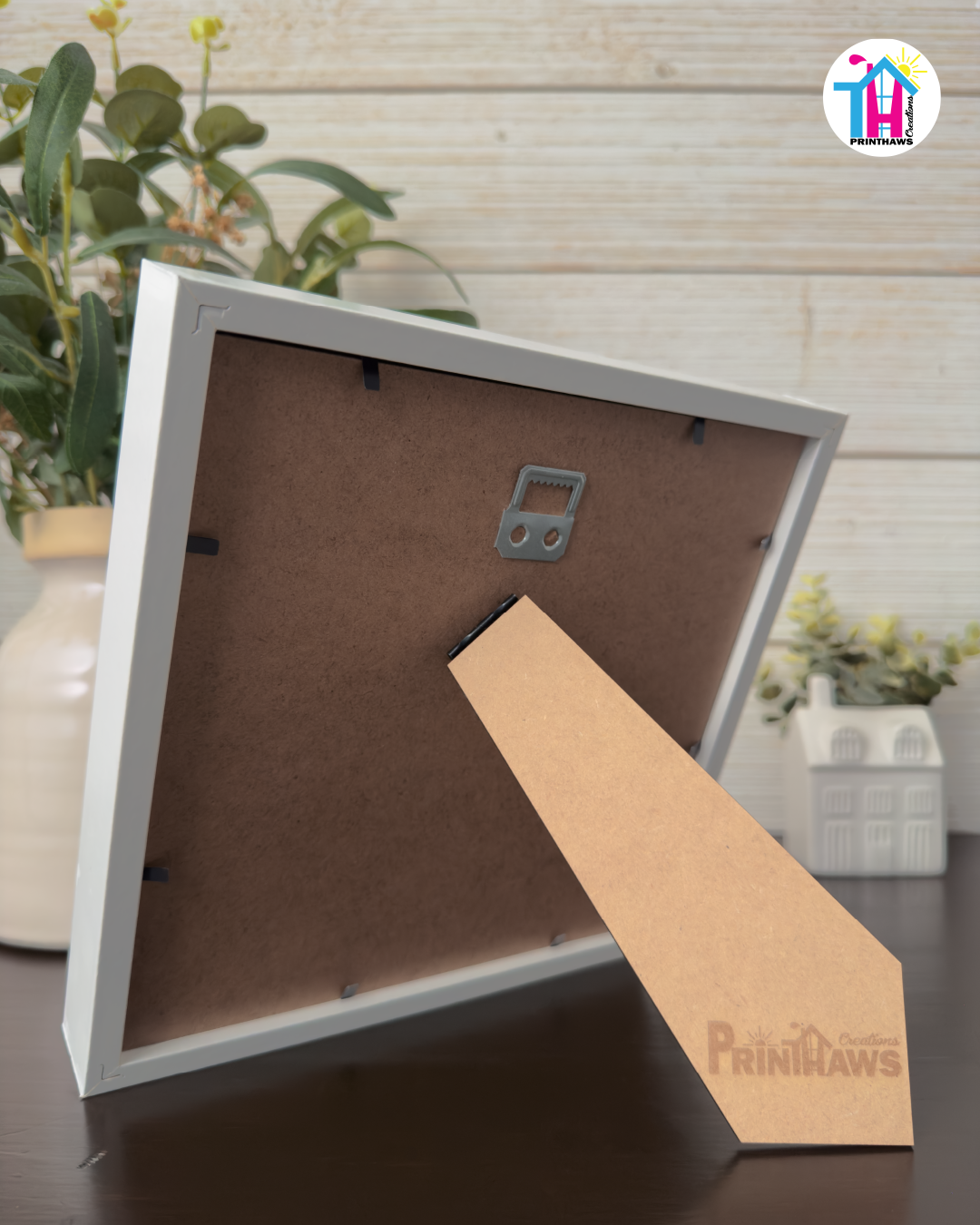 Crafted Memoirs Photo Frame By Printhaws Creations, Back View Of Matte White Frame Showing MDF Backing With Foldable Easel And Sawtooth Hanger